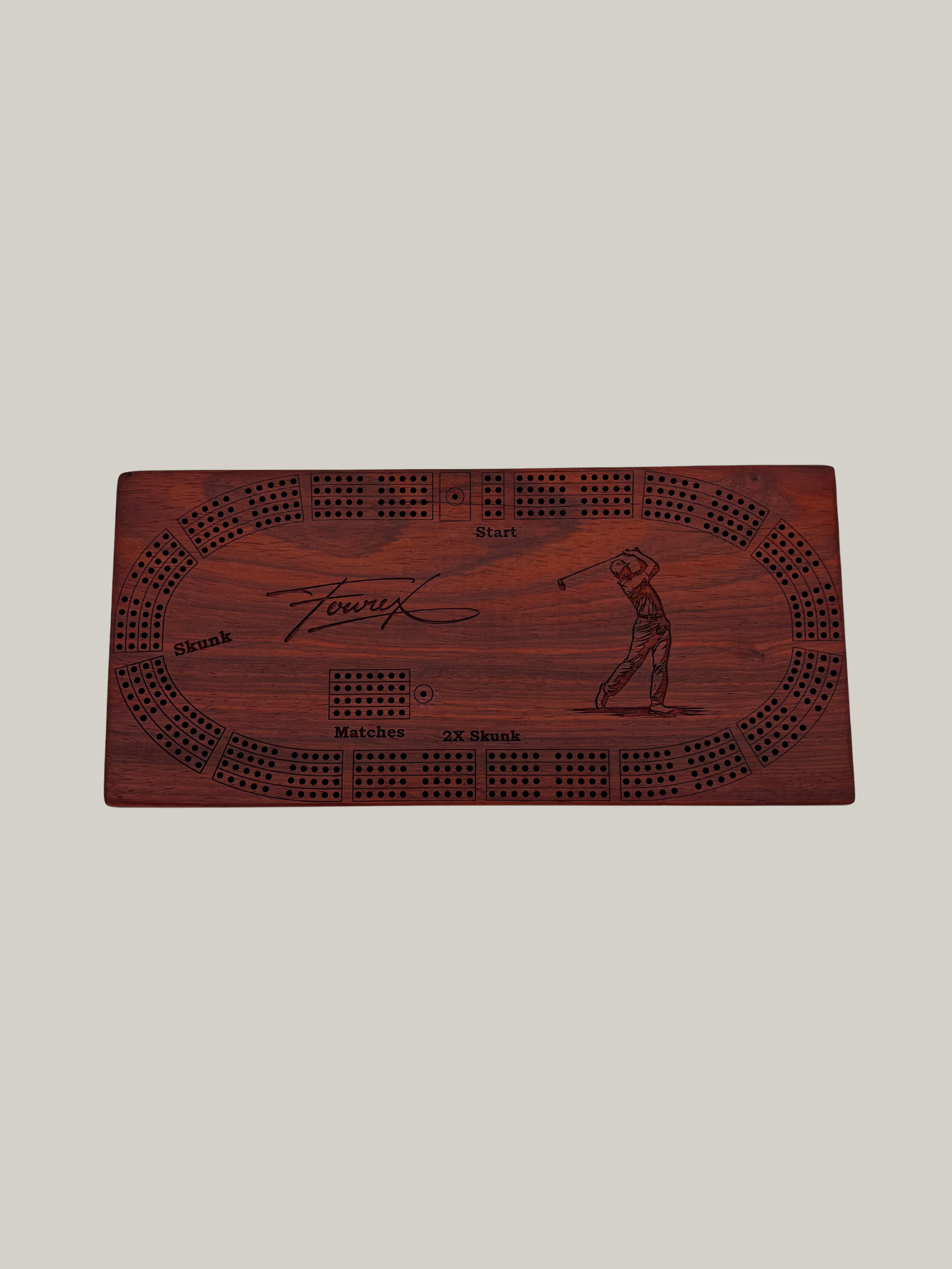 Wooden cribbage board with golf design.